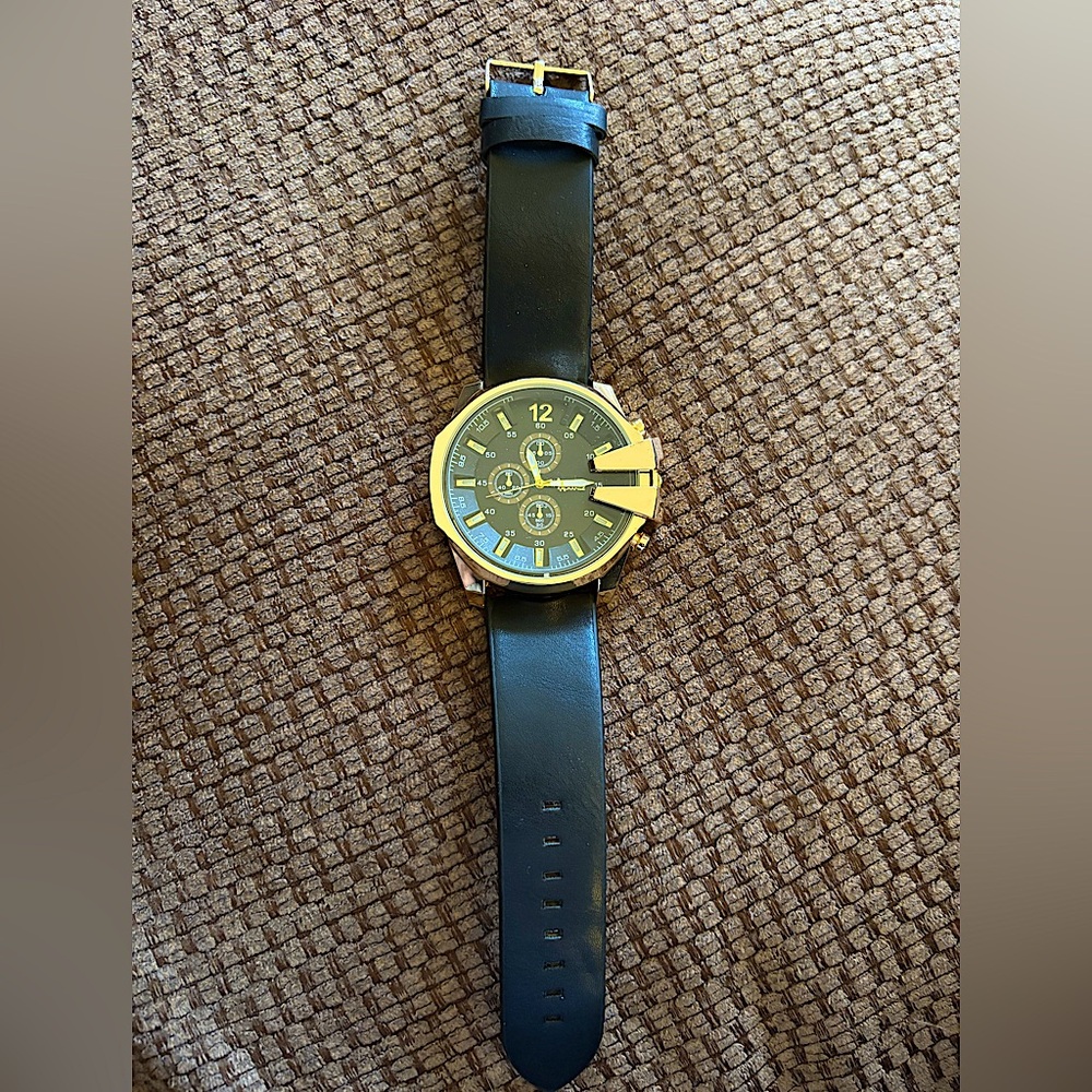 American ExchangeBlack and Gold Watch